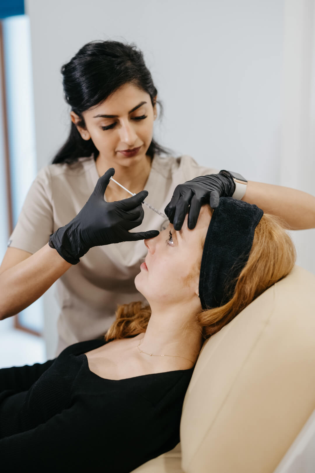 Dr. Divya administering anti-wrinkle injections to a patient at MedAesthetics Galway.